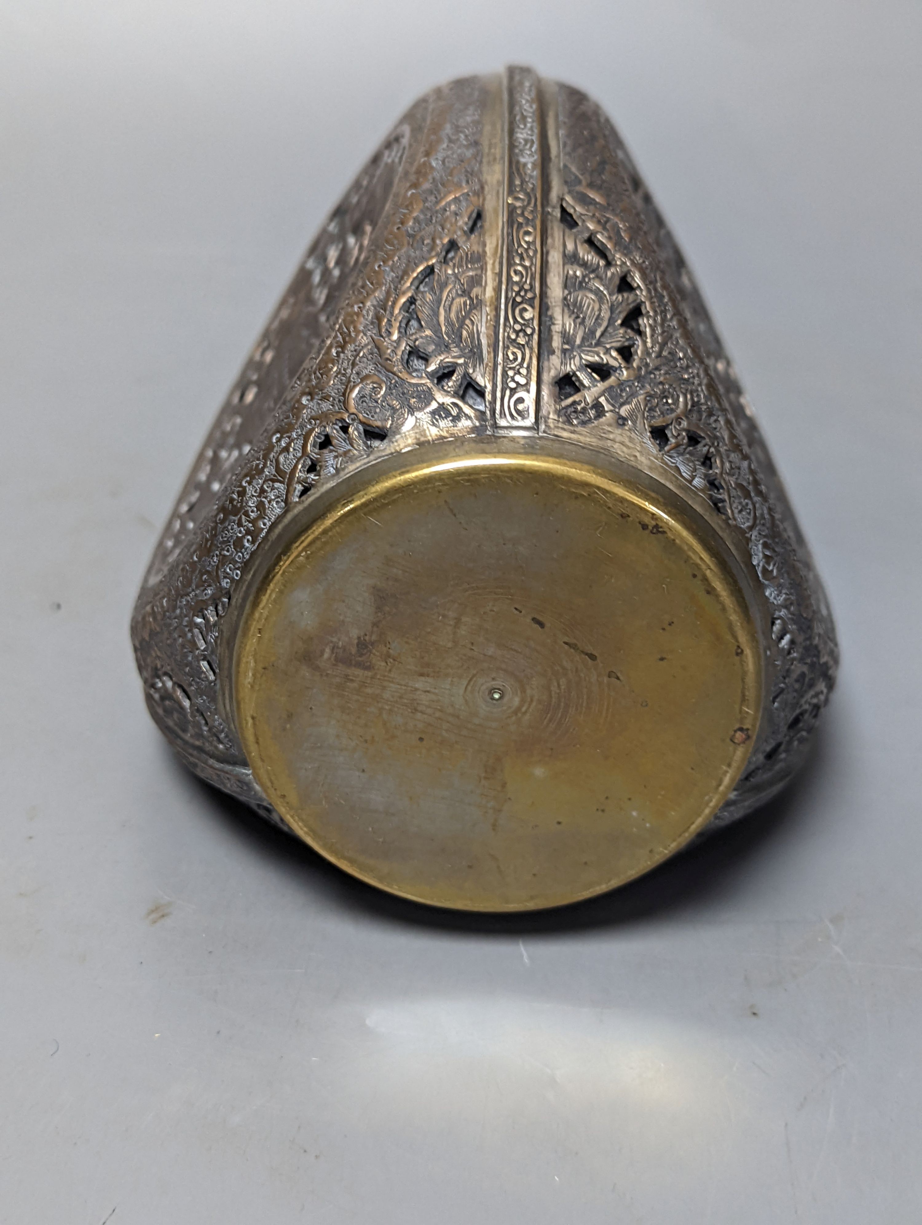 A Persian pierced brass cased glass dimple bottle 23cm